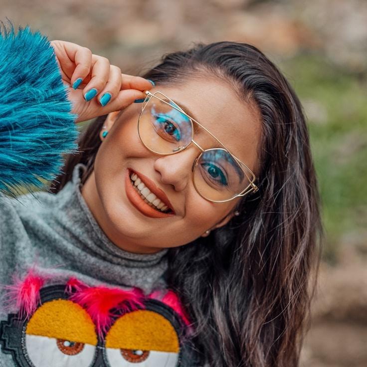 Kaveri Mehta, Lead Design Curator at Bright Core Labs, reviewing corporate floral arrangements